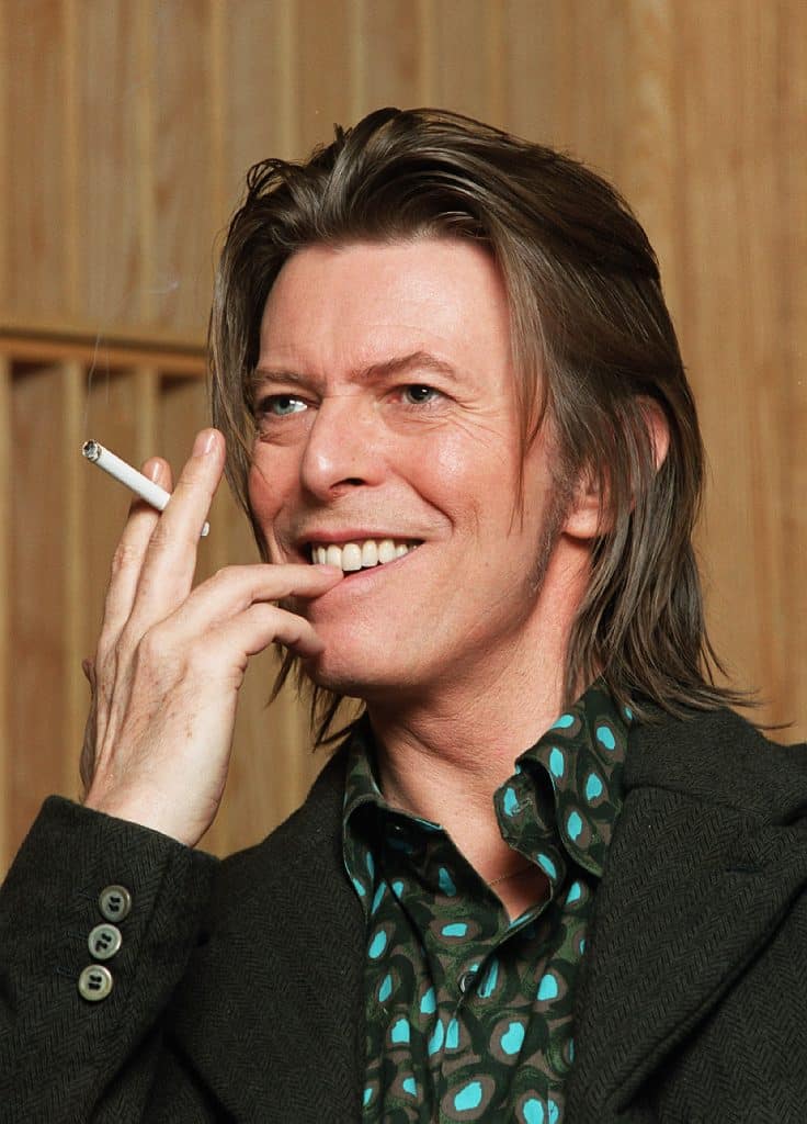 Musician David Bowie appears during a live radio interview with Radio One DJ's Mark and Lard at the Radio One Maida Vale studio on in 2001 in London.