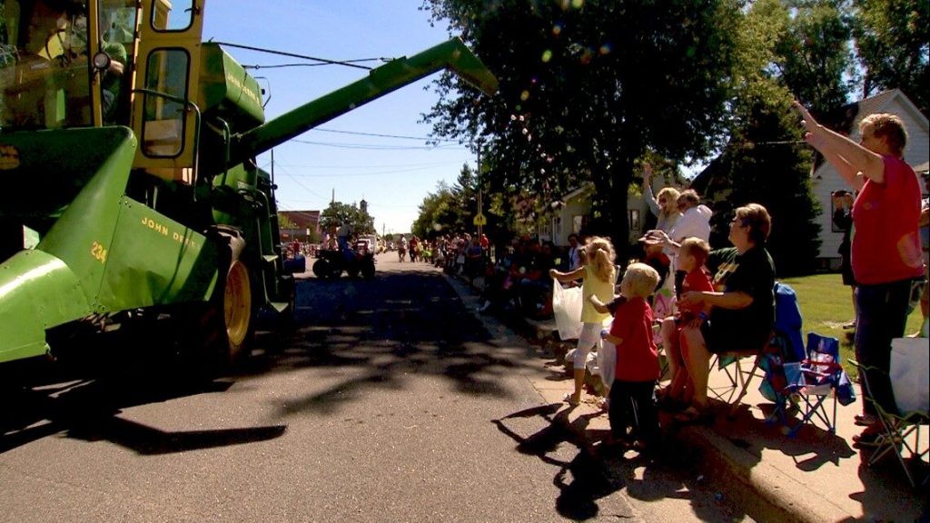 Tom Konz drops candy from his John Deere Combine in Minnesota.