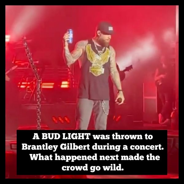 Brantley Gilbert slams Bud Light onto stage in protest. 