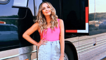 Carly Pearce in front of her tour bus