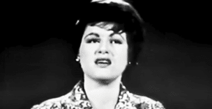 Patsy Cline is pictured here singing "I Fall to Pieces" during her last televised appearance.