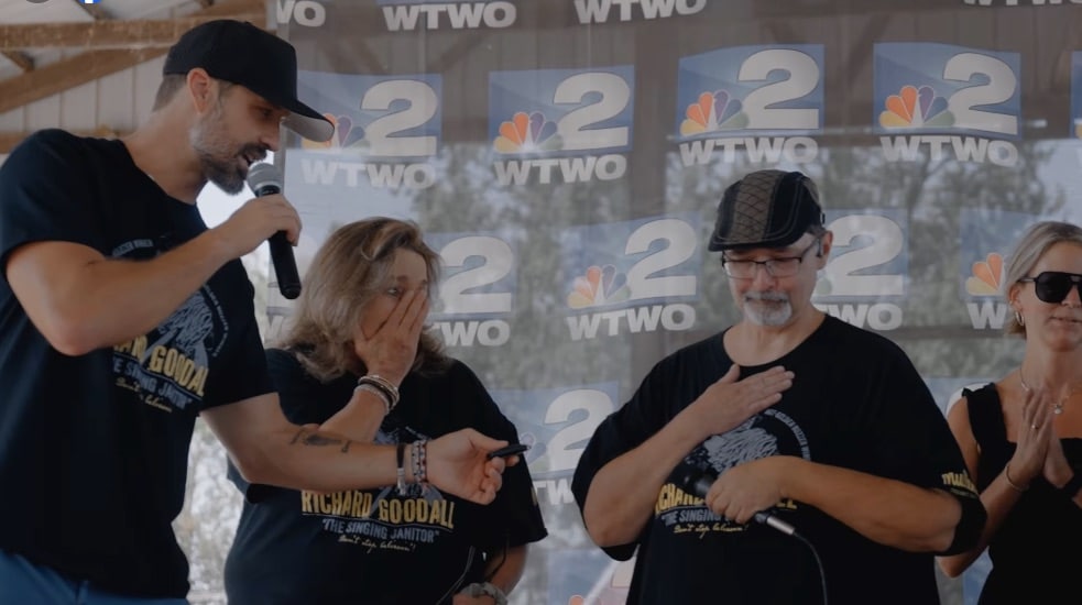 Walker Hayes hands "Singing Janitor" Richard Goodall the keys to a new car.