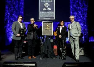 NASHVILLE, TENNESSEE - OCTOBER 20: (L-R) Stelen Keith Covel, Randy Owen, Tricia Covel and CEO of the Country Music Hall of Fame and Museum Kyle Young speak onstage at the Class of 2024 Medallion Ceremony at Country Music Hall of Fame and Museum on October 20, 2024 in Nashville, Tennessee