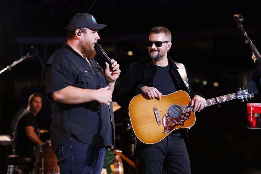 CHARLOTTE, NORTH CAROLINA - OCTOBER 26: (L-R) Luke Combs and Eric Church perform onstage at the Concert For Carolina Benefit Concert at Bank of America Stadium on October 26, 2024 in Charlotte, North Carolina.