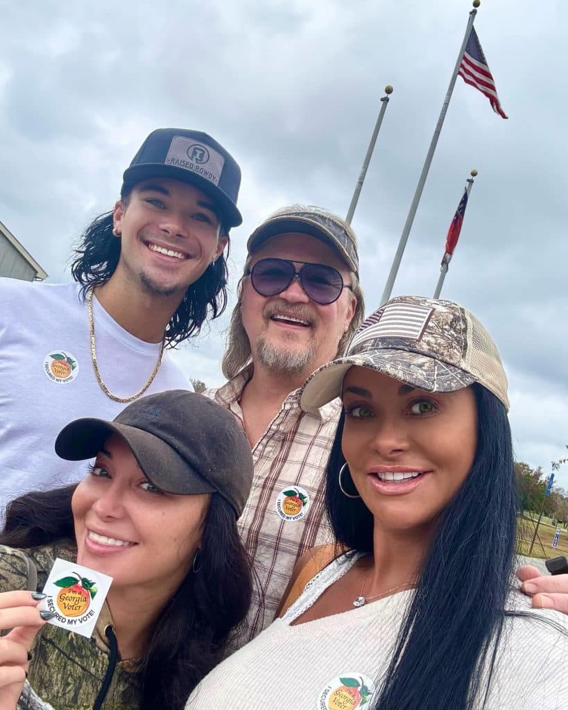 Travis Tritt and his family after voting