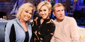 Julie and Todd Chrisley pose with their daughter, Savannah, center.