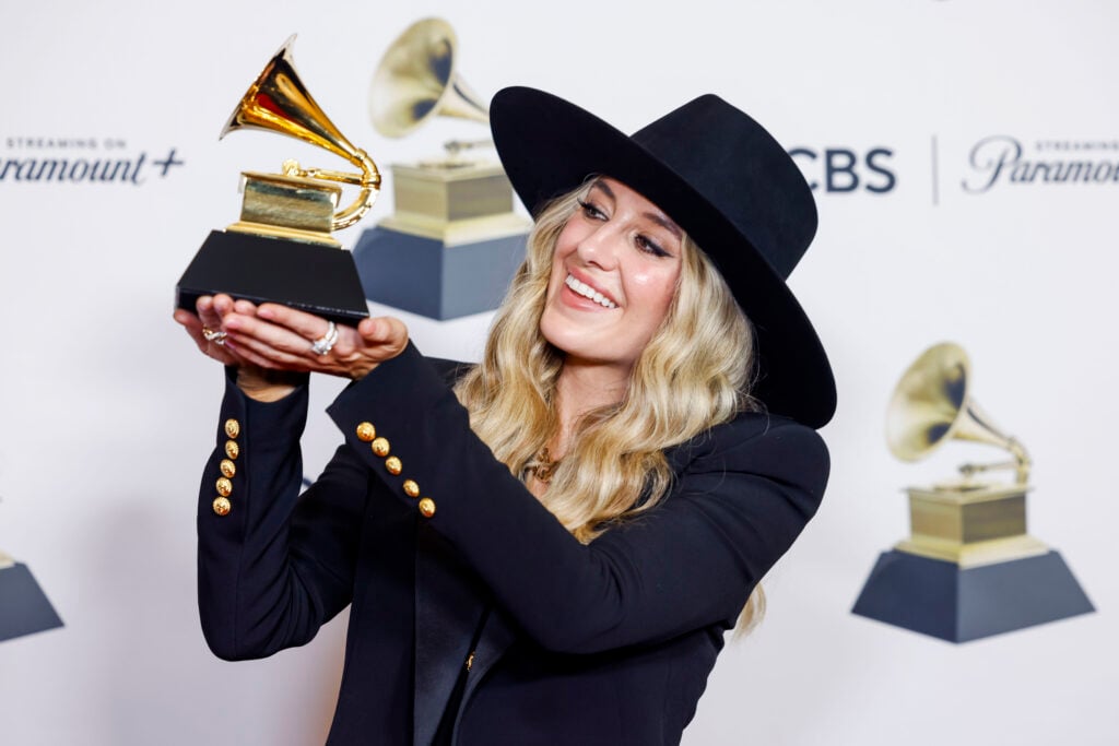 Lainey Wilson poses on the red carpet with her Grammys trophy after winning Best Country Album in 2024.
