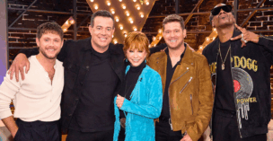 The coaches for Season 28 of the voice with host Carson Daly