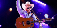 Cody Johnson performs "God Bless America" and fans sing along in a powerful moment